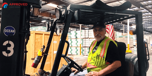 George Fomenko at home on his forklift