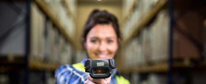 woman warehouse pointing scanner