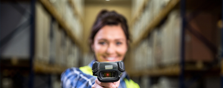 woman warehouse pointing scanner