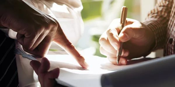 hands-closeup-writing-is-left hands writing plan