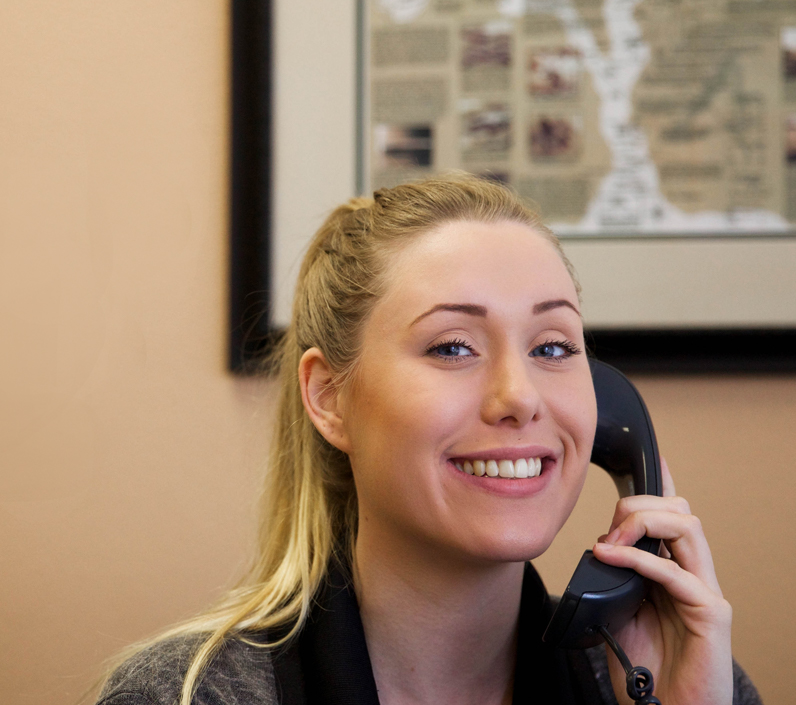 office worker smiling on phone