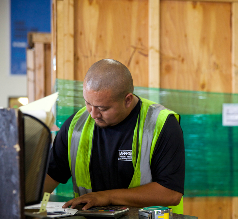 warehouse worker writing