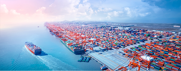 Container ship leaving the port, aerial view.