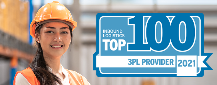 Warehouse employee smiling next to Top 100 logo