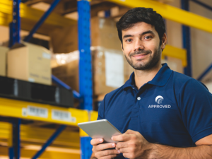 Approved warehouse worker with tablet